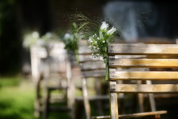 chairs with flowers on side